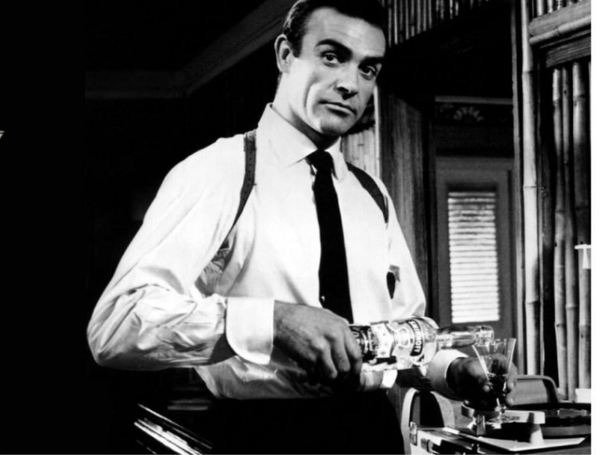 Sean Connery as James Bond pouring a vodka
